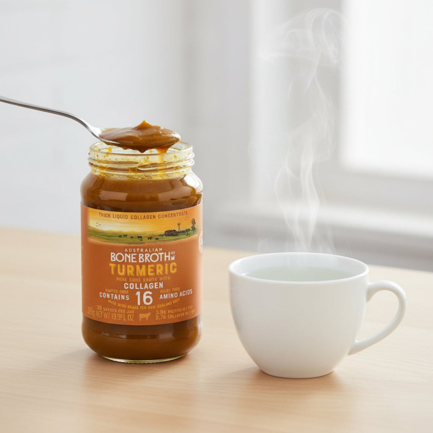 Jar of Australian Bone Broth with Turmeric on a white background